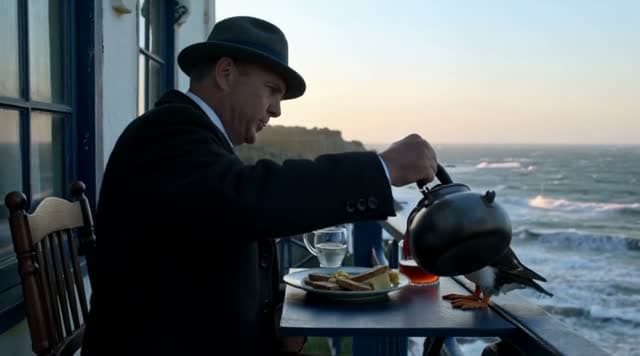 A lighthouse keeper has breakfast with a puffin
